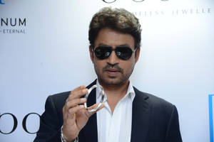 Irrfan Khan Holding Bracelet Wallpaper