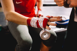 It Takes Strength To Put On The Hand Bandage Wallpaper