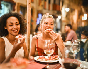 Italian Girl Eating Bruschetta Wallpaper