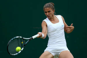 Italian Tennis Star Sara Errani In Action Wallpaper