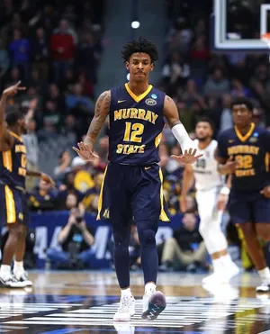 Ja Morrant In Dark Blue Jersey Wallpaper