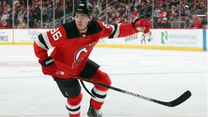 Jack Hughes In Action On The Ice Wallpaper
