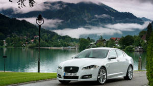 Jaguar Car By Lake Mountain Wallpaper