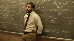 Jake Gyllenhaal Leaning On Blackboard Wallpaper