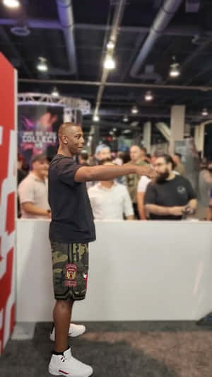 Jamahal Hill, The Renowned Ufc Fighter, Reaching Out In Confidence Wallpaper