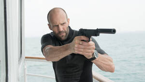 Jason Statham Aiming Gun Wallpaper