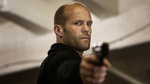 Jason Statham Pointing Gun Wallpaper