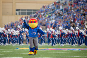 Jayhawk Mascot Cheering On The Field At University Of Kansas Wallpaper