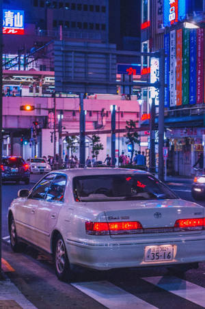 Jdm Car In Aesthetic Night City Wallpaper