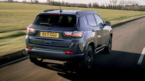 Jeep Compass On Road With Grass Wallpaper