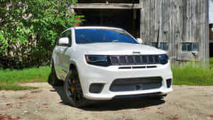 Jeep Trackhawk With Shrubs Wallpaper