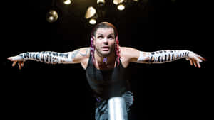 Jeff Hardy Kneeling As He Bows Elegantly Wallpaper