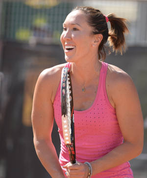 Jelena Jankovic Celebrating A Victory With Her Racket Wallpaper