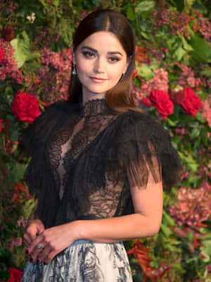 Jenna Coleman Smiling Elegantly In A Black Dress Wallpaper