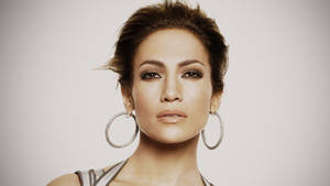 Jennifer Lopez Wearing Her Signature Hoop Earrings Wallpaper