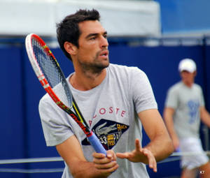 Jeremy Chardy In Action With Tennis Racket Wallpaper