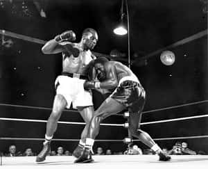 Jersey Joe Walcott's Knock-out Punch To Ezzard Charles Wallpaper