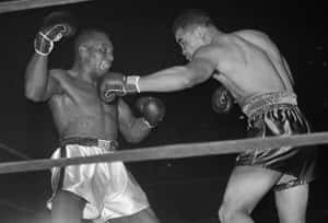 Jersey Joe Walcott Vs Joe Louis Boxing Match Wallpaper