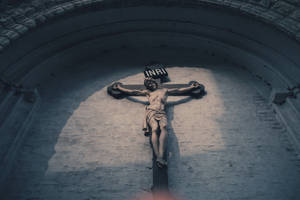 Jesus On Cross Outside Church Wall Wallpaper