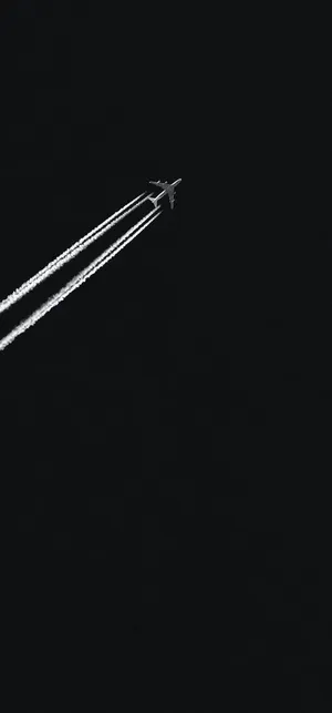Jet_ Contrail_ Against_ Dark_ Sky Wallpaper