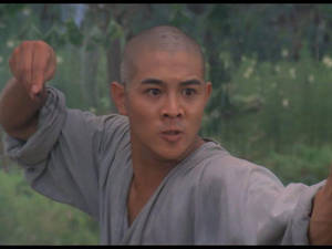 Jet Li Demonstrating Powerful Kung Fu Moves In Shaolin Temple. Wallpaper