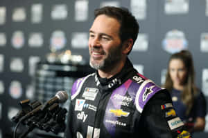 Jimmie Johnson In Action During A Nascar Race. Wallpaper