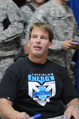 John Bradshaw Layfield Engaging With Soldiers Wallpaper