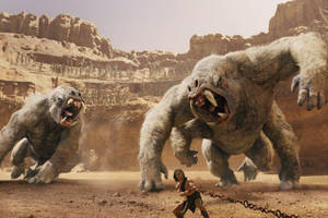 John Carter Confronting Huge Primates In A Mysterious World Wallpaper