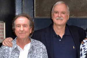 John Cleeseand Friend Smiling Wallpaper