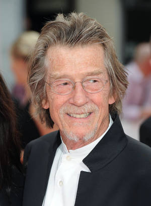 John Hurt In Suit And Glasses Wallpaper