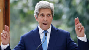 John Kerry Making A Quoting Hand Gesture Wallpaper