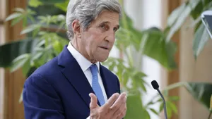 John Kerry Posing Near Green Plants Wallpaper