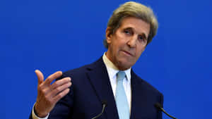John Kerry Speaking At A Press Conference Wallpaper
