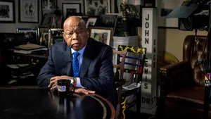 John Lewis Engaged In Deep Thought At A Meeting Table Wallpaper