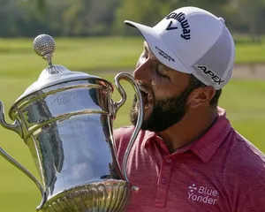 Jon Rahm Joking With His Trophy Wallpaper