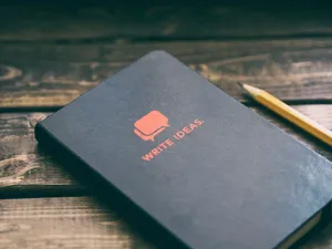 Journal With Yellow Pencil Wallpaper
