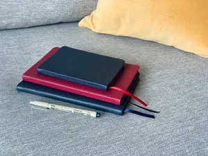 Journals With Red And Black Covers Wallpaper
