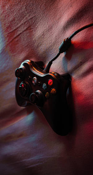 Joystick On Bed Wallpaper