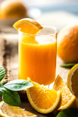 Juice With Fresh Orange Wedges Wallpaper