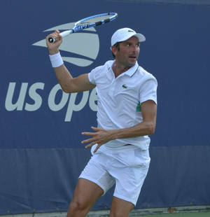 Julien Benneteau Exhibiting Skill On Tennis Court Wallpaper