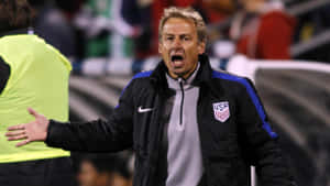 Jurgen Klinsmann Shouting And Extending Arms Wallpaper