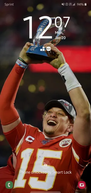 Kansas City Chiefs Quarterback Pat Mahomes Holding His Phone Wallpaper