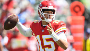 Kansas City Chiefs Quarterback Patrick Mahomes Attempts A Throw Wallpaper