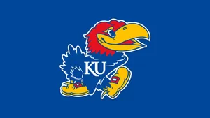 Kansas Jayhawks Basketball Team Showcases Their Skills During A Game Wallpaper