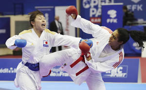 Karate Two Women Fighting Blue Belt Red Belt Wallpaper