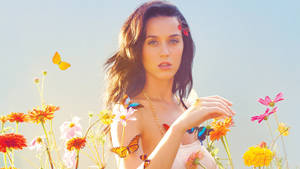 Katy Perry Enjoying A Stroll Through A Colorful Flower Field Wallpaper