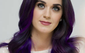 Katy Perry Smiling As She Rocks The Stage Wallpaper