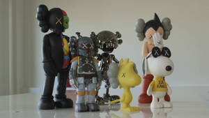 Kaws Collectible Sculptures Wallpaper