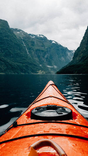 Kayaking Beside Mountains Wallpaper