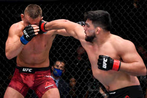 Kelvin Gastelum Punching Opponent Wallpaper